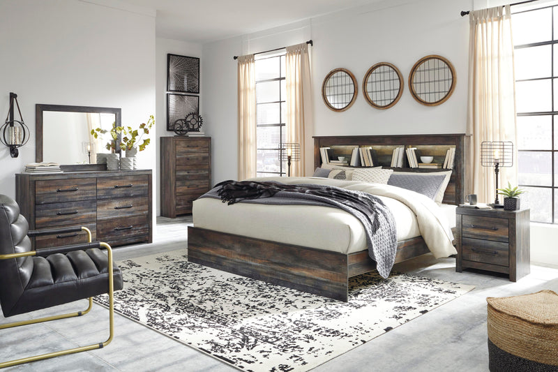 Dormitorio Drystan con cama y librería de paneles