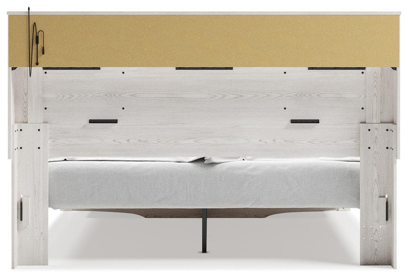 Cama tapizada Altyra con estantería y almacenamiento